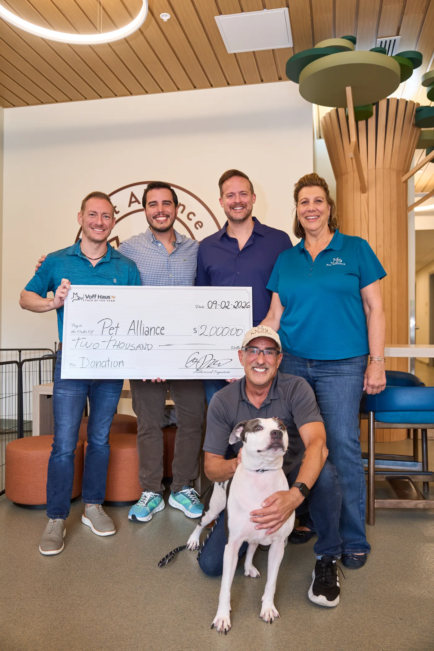 The Voff Haus team presenting a $2,000 cheque to Pet Alliance of Greater Orlando