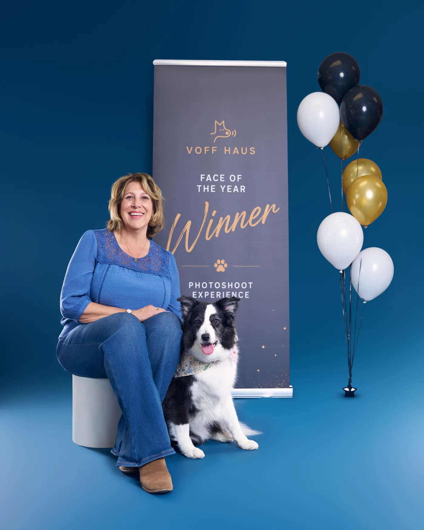 Breeze and her owner in front of the Face of the Year winner banner